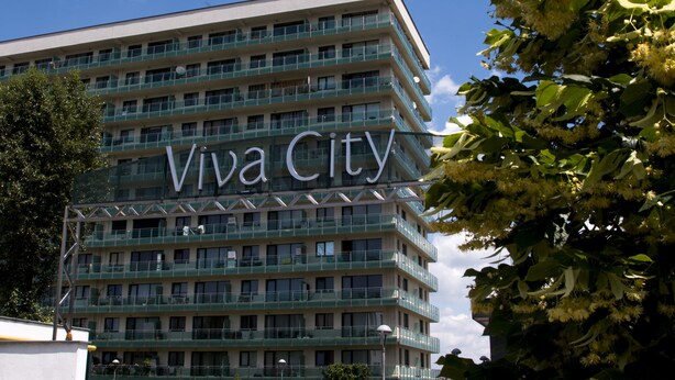 A multi-story building with a sign reading "Viva City." - AdrianApartments (Cluj-Napoca)