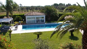 Seasonal outdoor pool, pool umbrellas, pool loungers