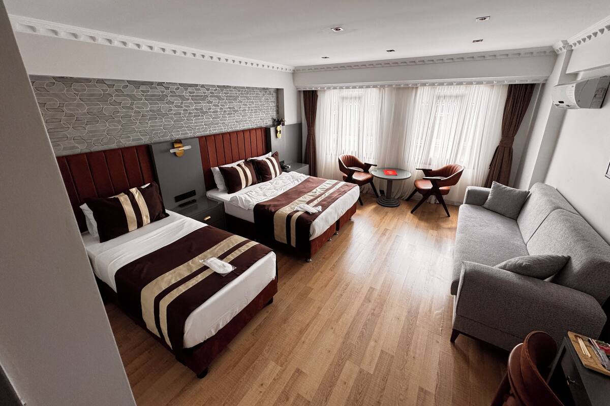 Standard Quadruple Room | 1 bedroom, in-room safe, laptop workspace, blackout drapes