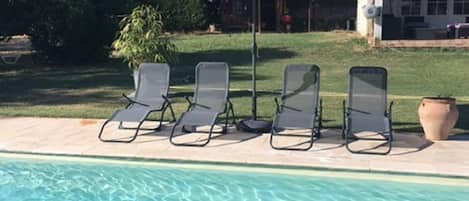 Outdoor pool, open 8:00 AM to 10:00 PM, pool umbrellas, sun loungers