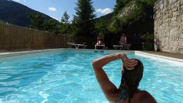 Seasonal outdoor pool, open 10:30 AM to 7:00 PM, pool umbrellas
