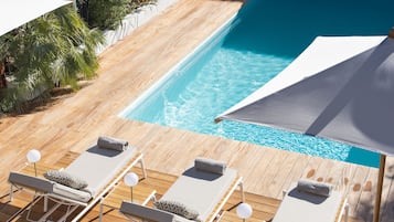 Seasonal outdoor pool, a heated pool, pool umbrellas, sun loungers