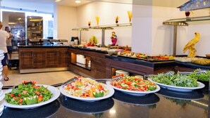 A buffet with various salads and dishes.