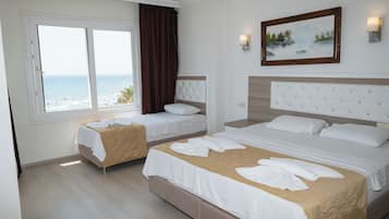 Junior Quadruple Room, Sea View | Minibar, desk, free cribs/infant beds, rollaway beds