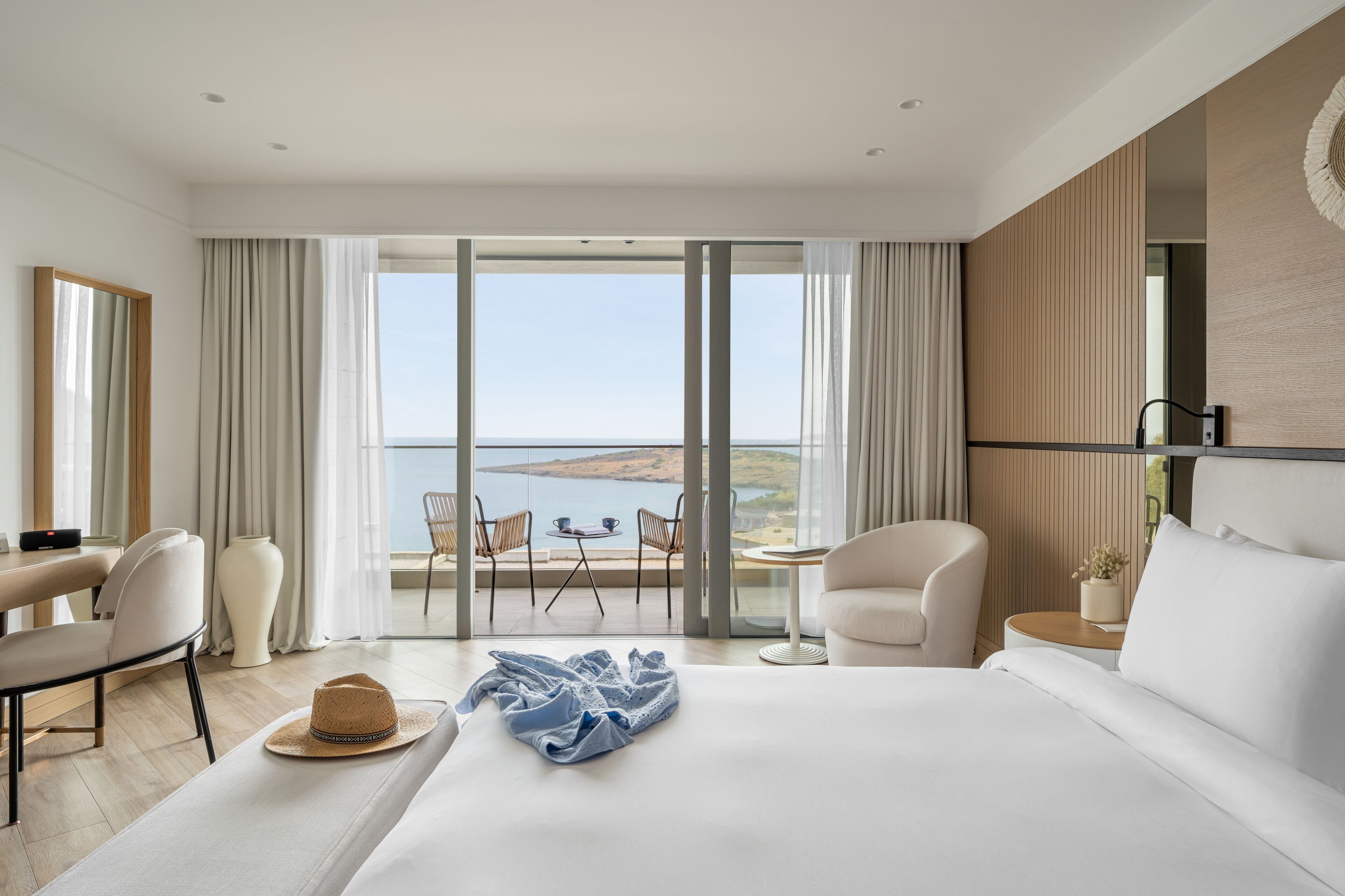 deluxe room, 1 king bed, sea view | minibar, in-room safe, individually decorated, desk