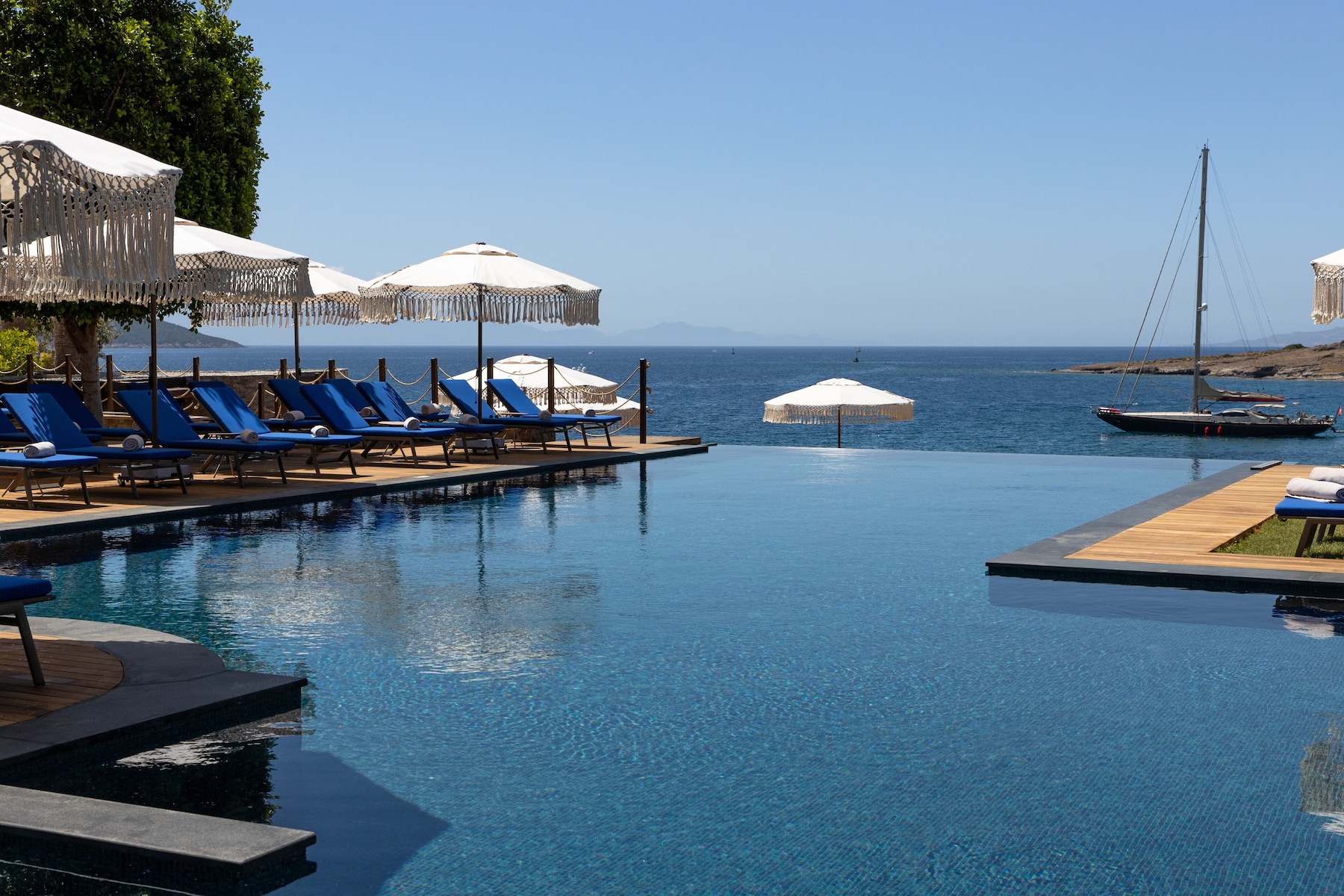 Seasonal outdoor pool, open 7:00 AM to 7:00 PM, pool umbrellas