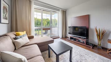 Apartamento (Spacerowa 21/35) | Zona de estar | Una televisión de pantalla plana