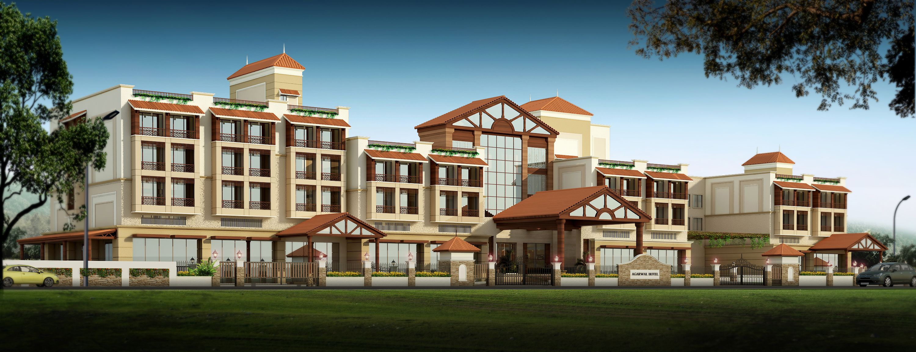 A hotel with multiple buildings, a central entrance, and a well-maintained lawn.