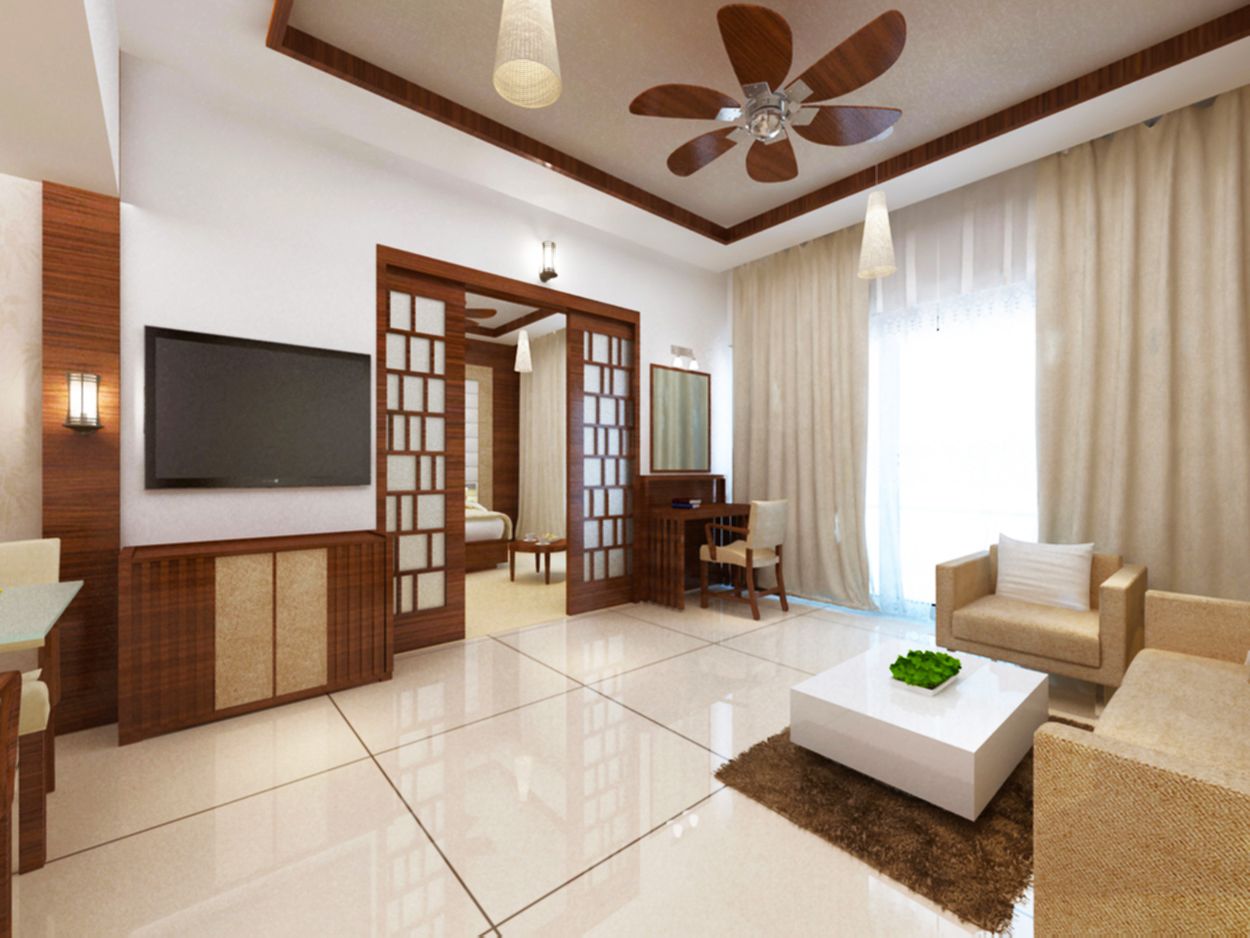 A modern living room with a flat-screen TV, a ceiling fan, a dining area, and a sofa.