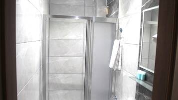 Economy Double Room | Bathroom | Shower, free toiletries, hair dryer, slippers
