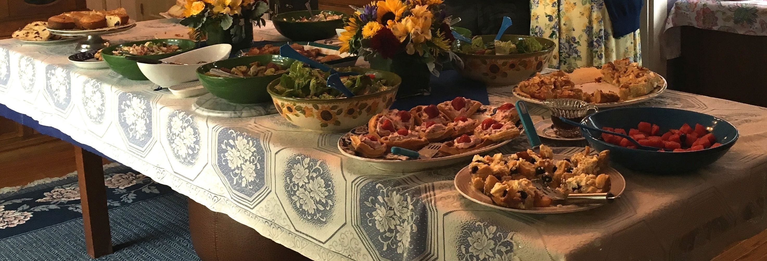 A table with various dishes and bowls, likely set for a meal.