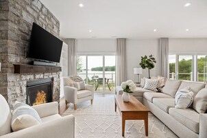 Premium Suite, 3 Bedrooms, Lake View | Living area | 50-inch TV with cable channels