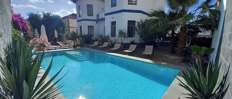 Outdoor pool, pool umbrellas, pool loungers