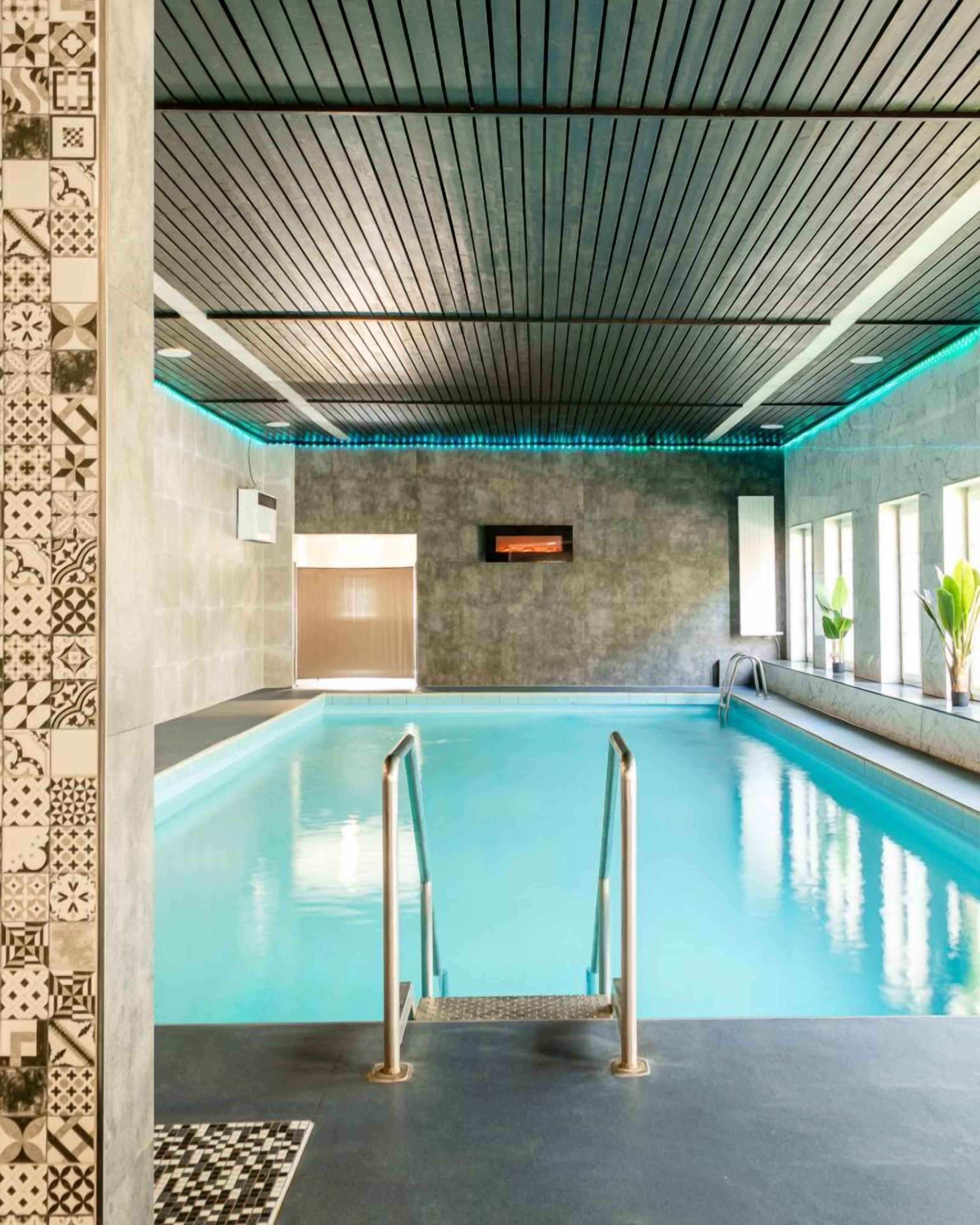 Indoor pool, open 10:00 AM to 9:00 PM, pool loungers