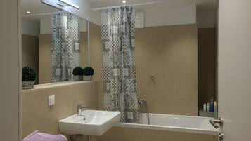 Hair dryer, towels, soap, shampoo