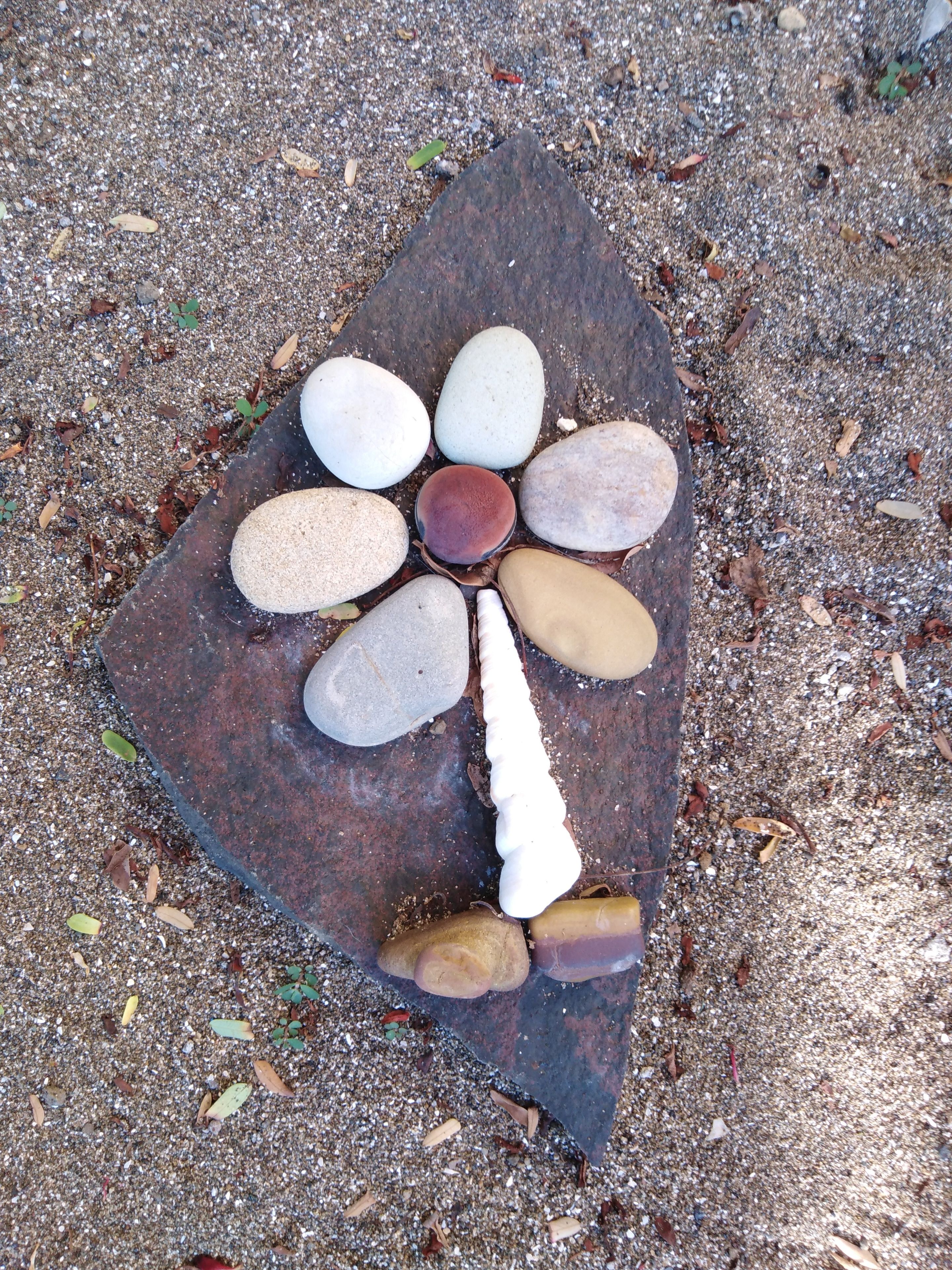 A stone arrangement on a concrete surface.