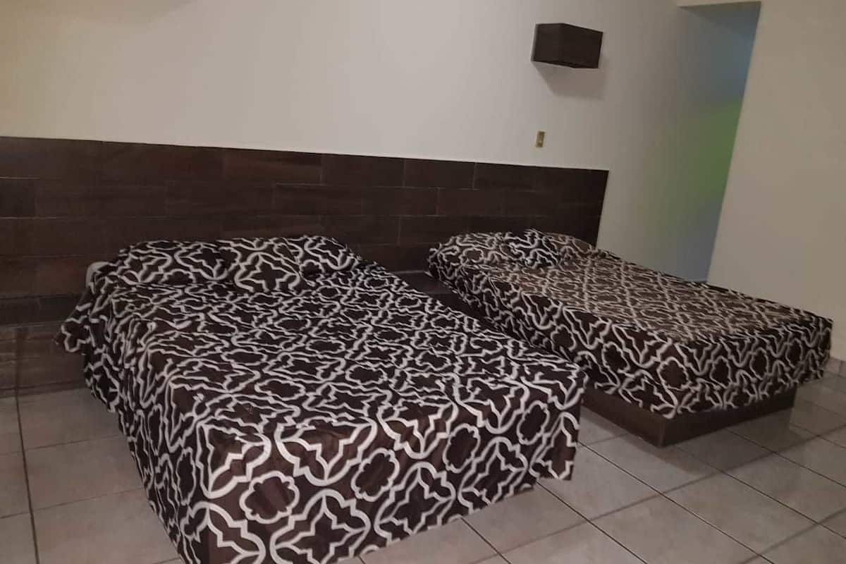 Economy Room, City View | Blackout drapes, bed sheets