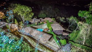 A rooftop garden with a swimming pool, multiple gazebos, and lush greenery. - La Toscana Hills (Atenas)