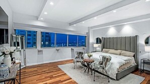 Deluxe Apartment, City View | In-room safe, blackout drapes, soundproofing, iron/ironing board - The Crown Towers (Los Angeles)