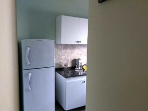 Villa | Private kitchen | Fridge, microwave, oven, cookware/dishes/utensils