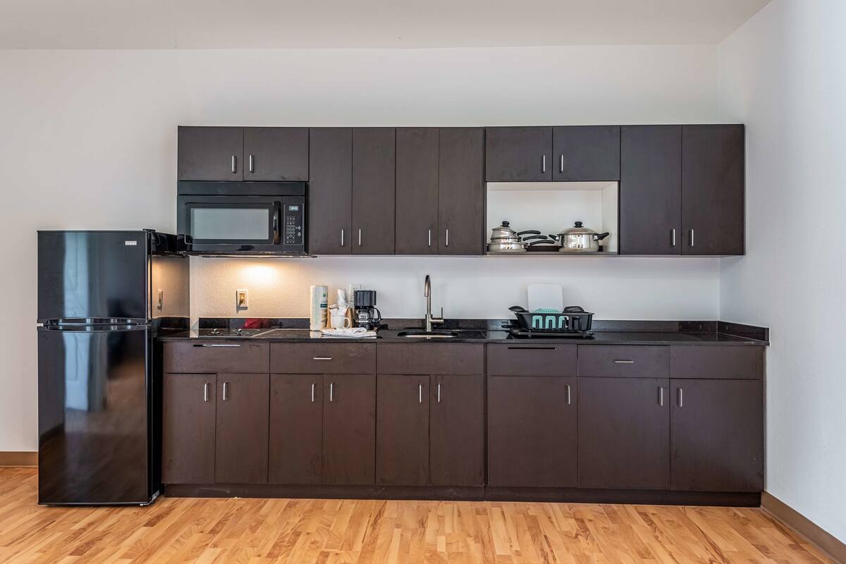 full-sized fridge, microwave, stovetop, coffee/tea maker