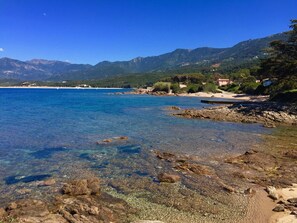 On the beach, sun-loungers
