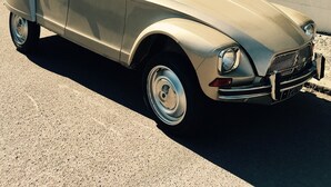 A vintage car parked in front of a building with multiple windows and a sloped roof. - House of subdivision, Le Croisic  (Le Croisic)
