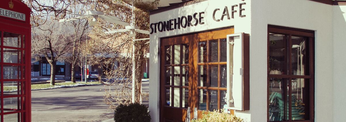 A stonehorse cafe with a traditional design, featuring a prominent entrance and large windows.