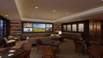 A modern lounge area with a sofa, dining table, and chairs, featuring a large TV screen displaying sports.