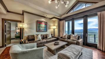 4 Bedroom Condominium | Living room | 50-inch flat-screen TV with satellite channels, TV, fireplace