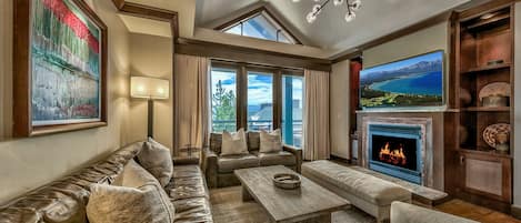 4 Bedroom Condominium | Living area | 50-inch flat-screen TV with satellite channels, TV, fireplace