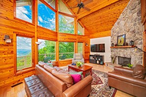 Flat-screen TV, fireplace, DVD player, books