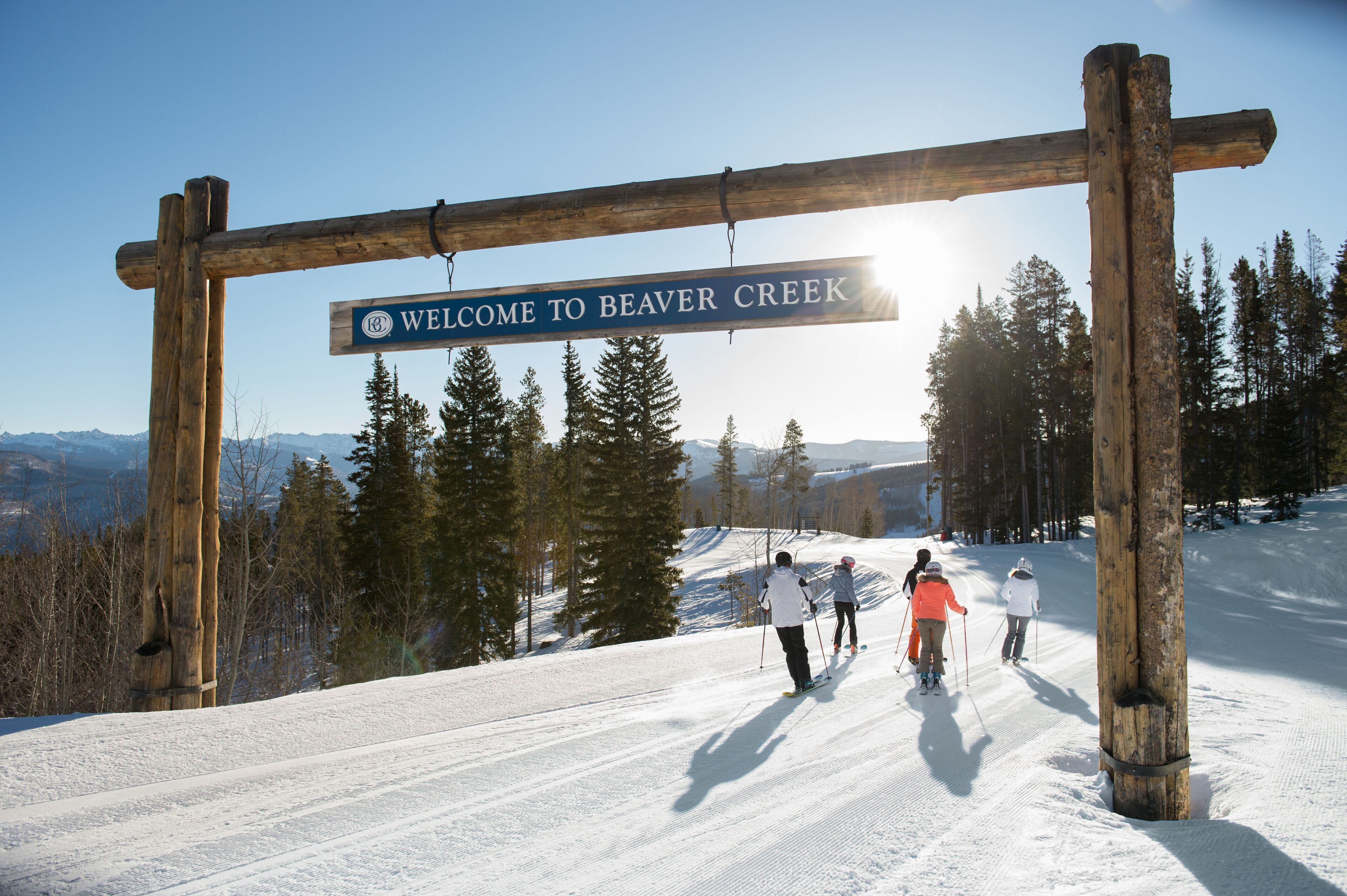 A wooden sign with "WELCOME TO BEAVER CREEK" written on it.