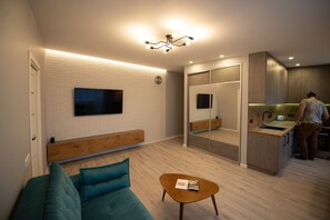 Appartement Confort | Coin séjour | Télévision de 105 cm avec chaînes par satellite