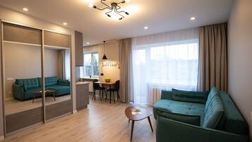 Comfort Apartment | Living area | 105-cm TV with satellite channels
