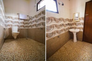 Bathroom features a wave-patterned tile design, toilet, sink, and shower area.