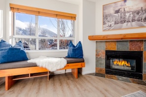 Living Room - Enjoy the stunning mountain view while lounging on the window-side bench