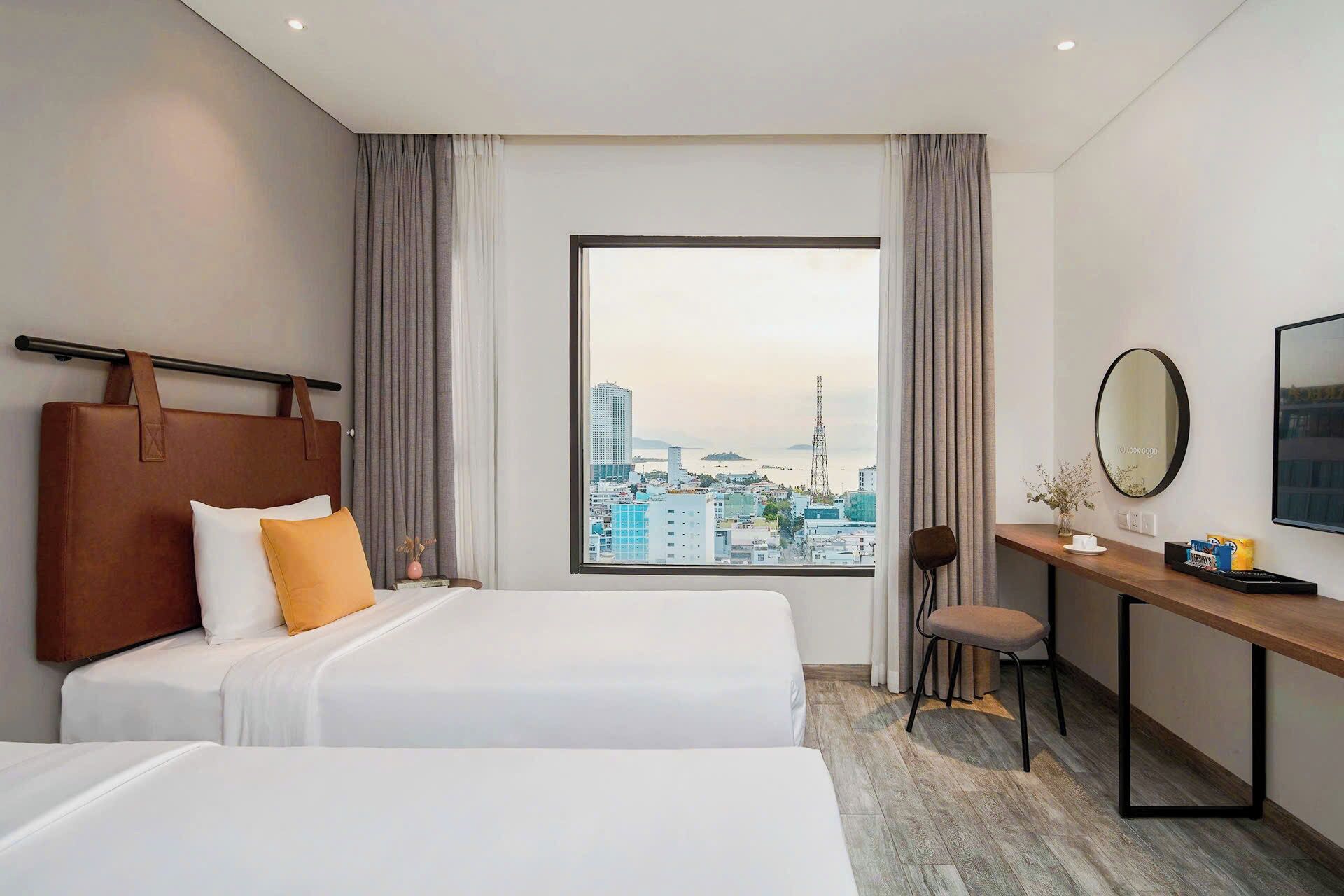 Quarto casal ou duplo superior, vista parcial para o mar | Roupas de cama premium