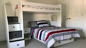 A bunk bed with a desk and drawers, a wardrobe, and a carpeted floor. - PRICE REDUCED Beautiful 3 Bedroom, 21/2 Bath Condo,walking distance to the beach (North Wildwood)