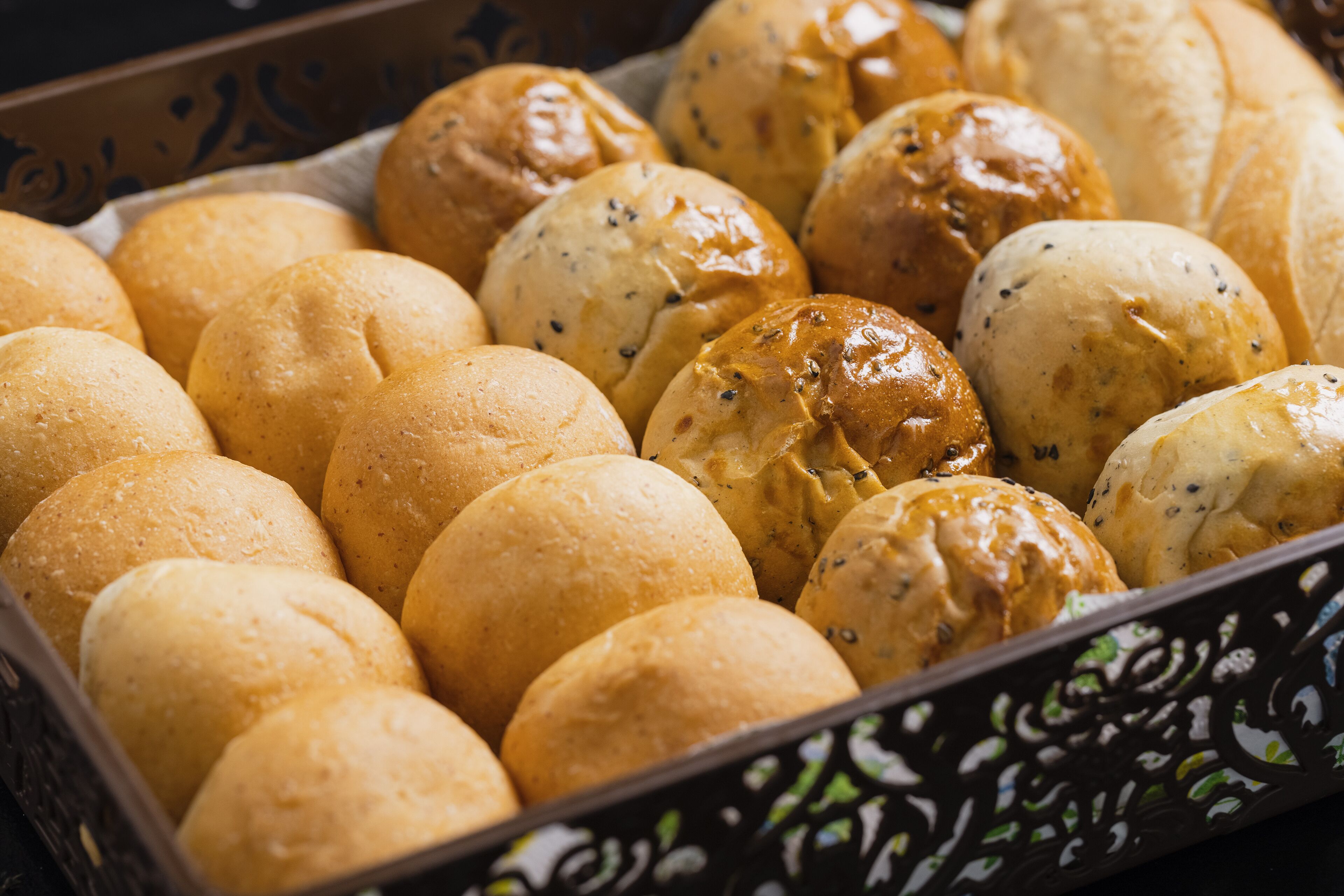 A tray of freshly baked bread rolls.