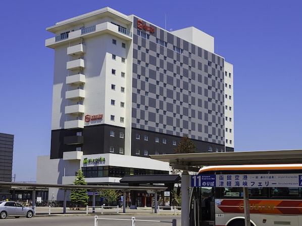 A hotel with a modern design, featuring a checkered facade and multiple balconies. - La'gent Stay Hakodate Ekimae (Hakodate)