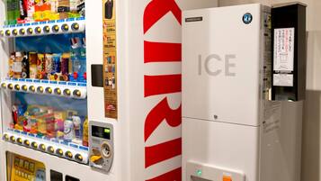 A vending machine with a Kirin logo and an ice dispenser.