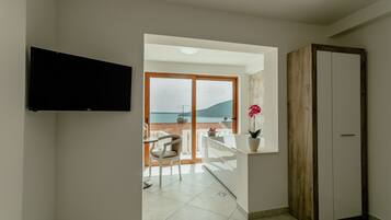 Luxury Studio Suite, Sea View | Living area | Flat-screen TV
