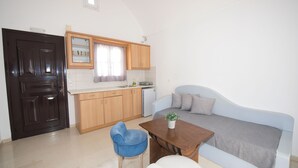 Apartment, 1 Bedroom | Living area | 27-inch LED TV with digital channels - Ira Apartments (Santorini)