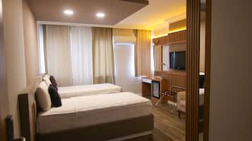 Quarto standard | Cofres nos quartos, Wi-Fi de cortesia, roupa de cama