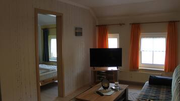 Apartment, 1 Bedroom (incl. EUR 40 cleaning fee per stay) | Living area | Flat-screen TV