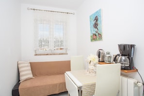 Apartment, Multiple Beds | Living room | TV