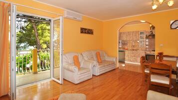 Apartment, Multiple Beds | Living room | TV