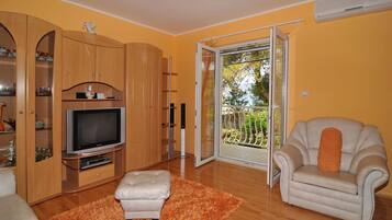 Apartment, Multiple Beds | Living room | TV