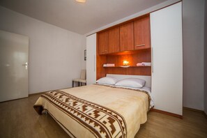 Appartement, Plusieurs lits | Accès au Wi-Fi (inclus), literie fournie